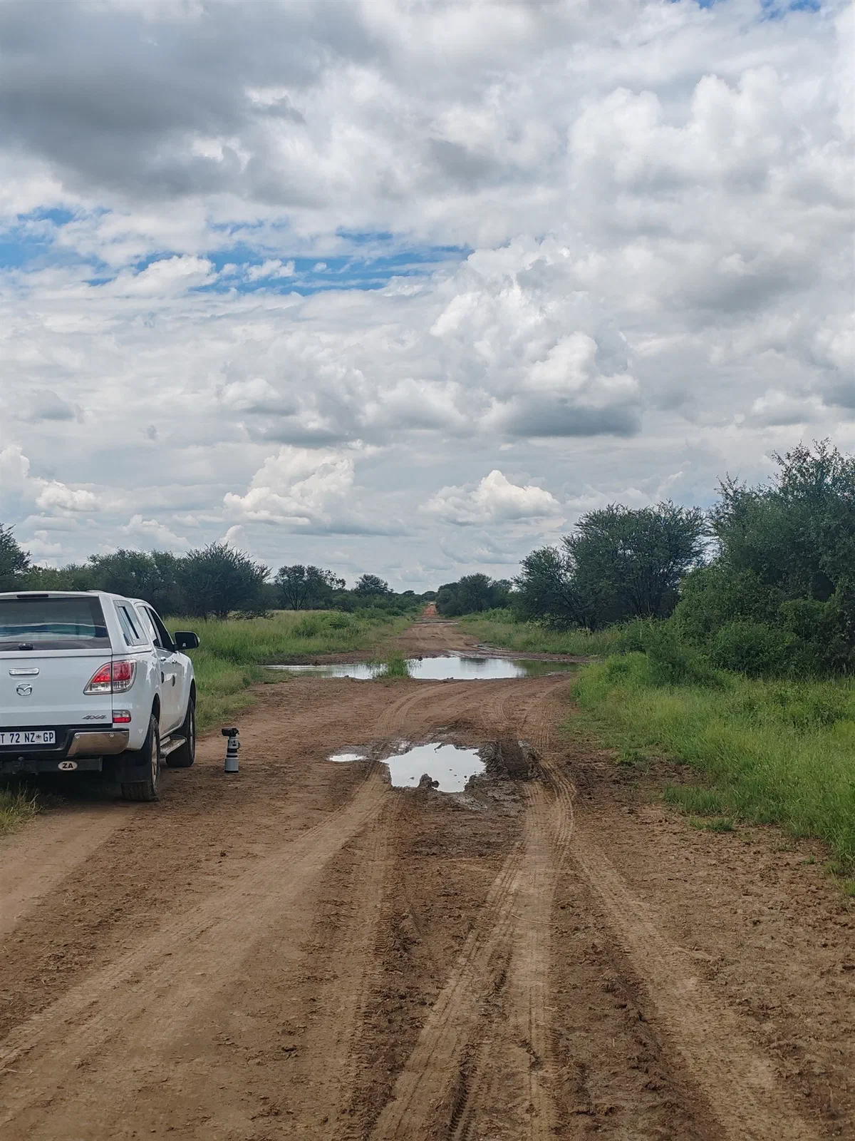 The vehicle on a muddy track after rain
